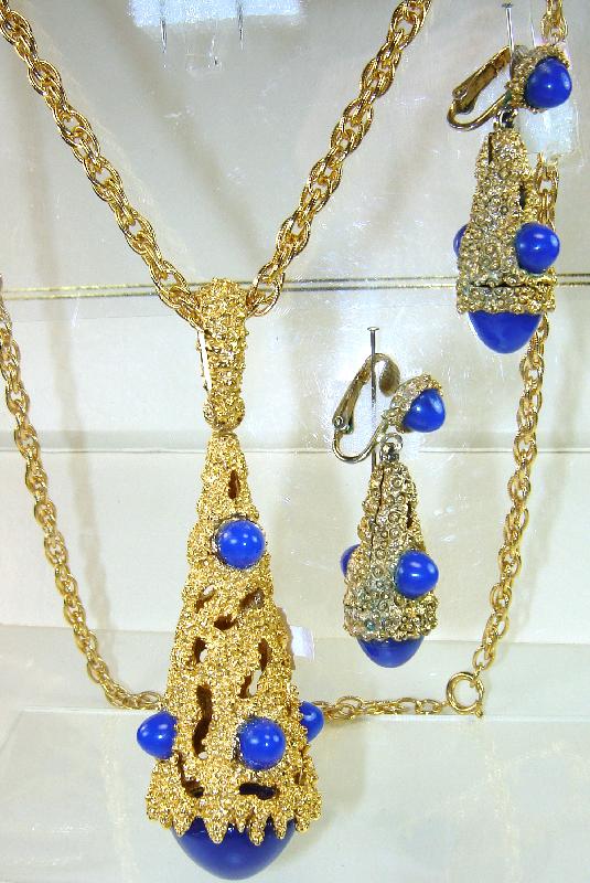 Front view of Blue Cabochons Plastic Pendant