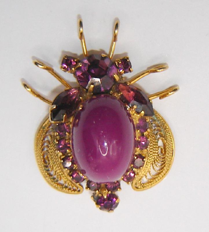 Front view of Purple (cardinal) Cabochons Brooch